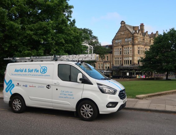 An Aerial & Sat Fix cvan paked in Harrogate with Betty's Cafe in the background